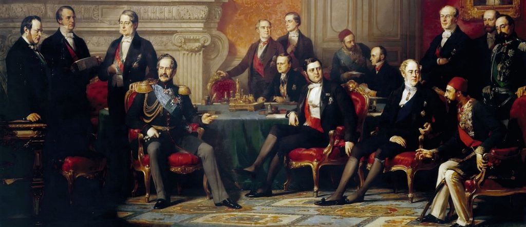 An oil painting of the 1856 Congress of Paris, depicting a group of 19th-century European and Ottoman diplomats, including Grand Vizier Ali Pasha, gathered in an opulent hall to negotiate the peace treaty that ended the Crimean War.