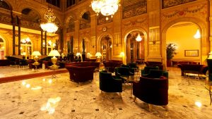 The opulent lobby of a luxury hotel in Istanbul, offering an elegant retreat with magnificent chandeliers and marble floors for discerning travelers.